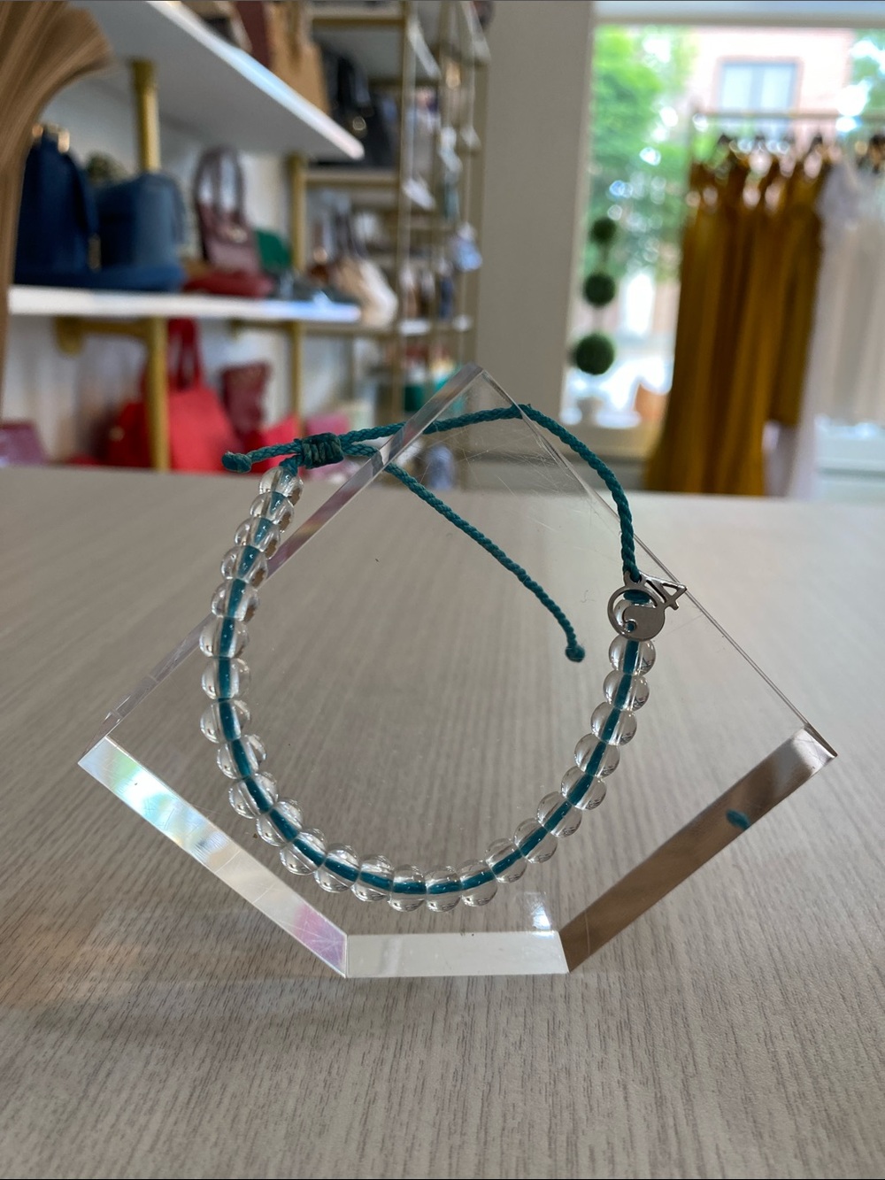 4Ocean Clear Glass Bead Bracelet with Teal Cord